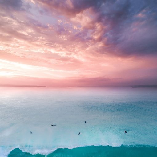 birds eye view of people on beach during sunset