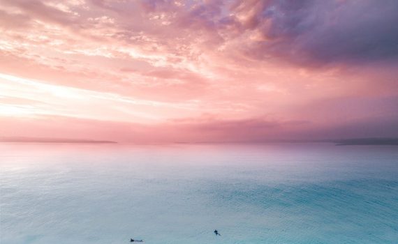birds eye view of people on beach during sunset